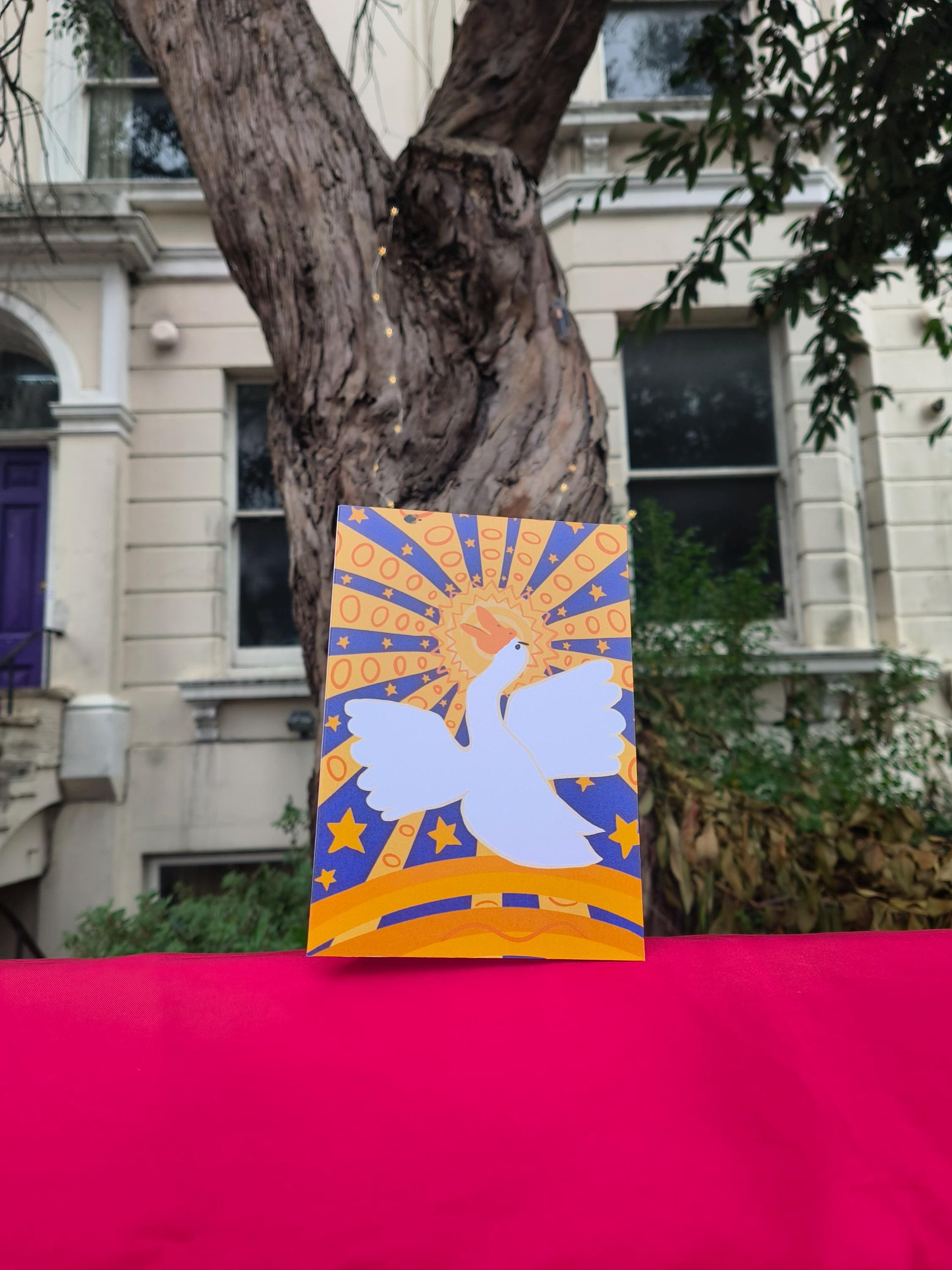 Celestial Goose Greeting Card – Whimsical Bright Art Design with Stars and Sunburst